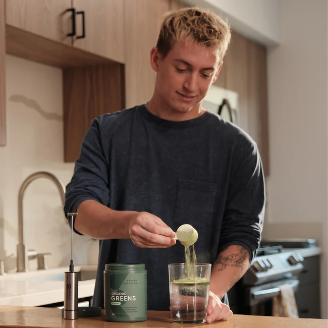 Person preparing Organic Greens